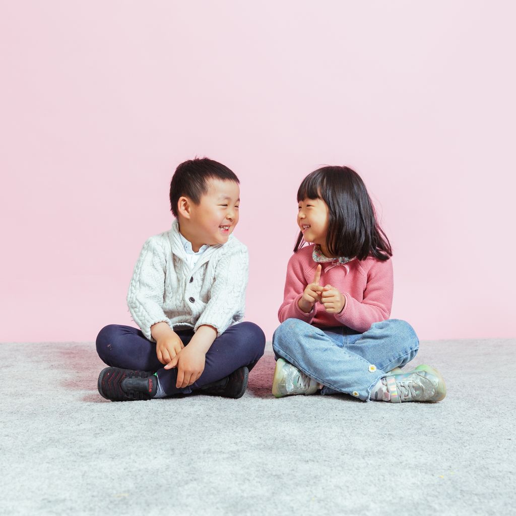 Children chatting at a childcare centre, engaging in early learning and social development activities.